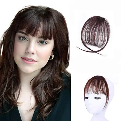 Tizzic dark brown synthetic clip in bangs on a neutral background