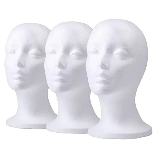 Three white foam mannequin heads for wig display