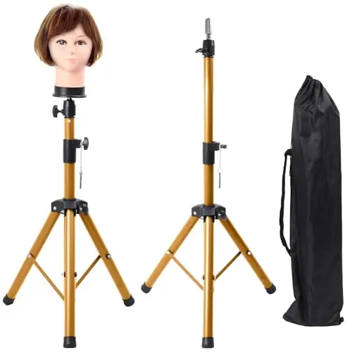 Superhairpieces gold foldable metal wig stand tripod on a hard floor
