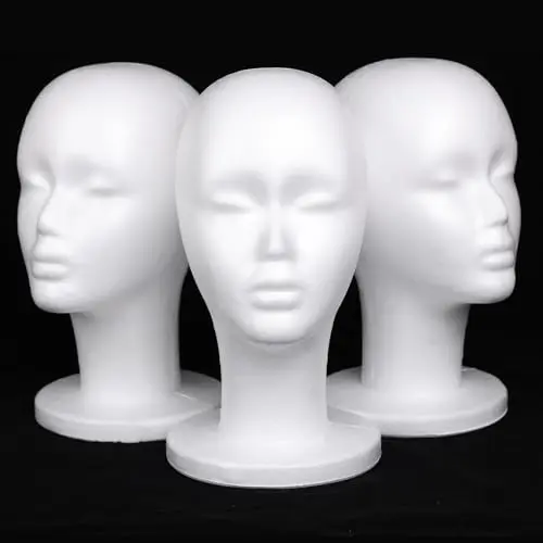 Three white foam wig heads with sturdy base